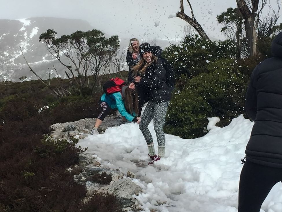 People playing with snow near Cradle Mountain Hotel