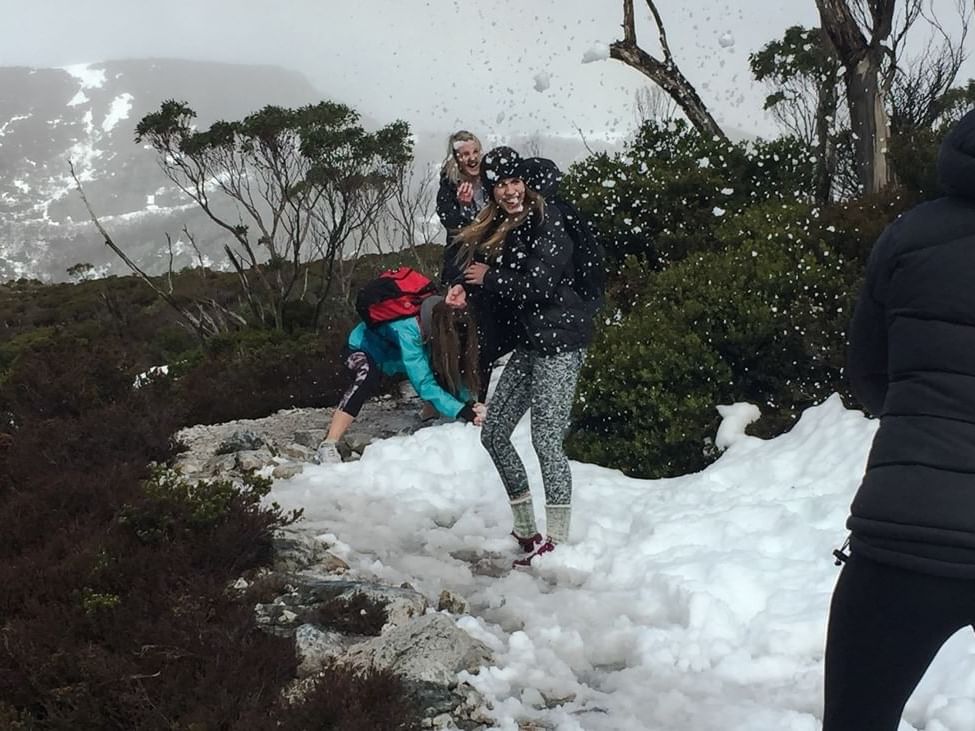 People playing with snow near Cradle Mountain Hotel 