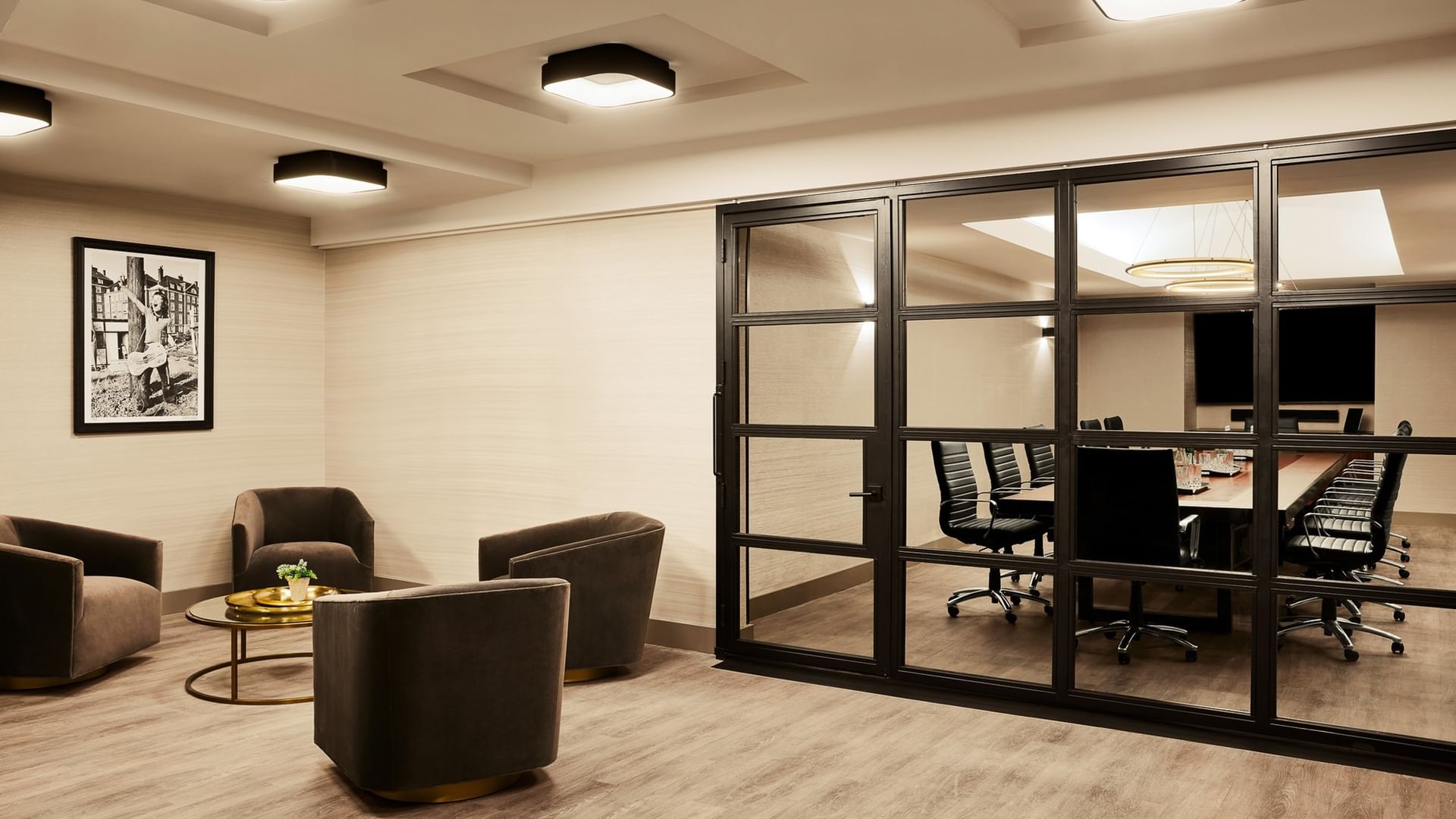 Modern Executive Boardroom with glass-walled conference space and lounge seating at Gansevoort Meatpacking NYC in New York
