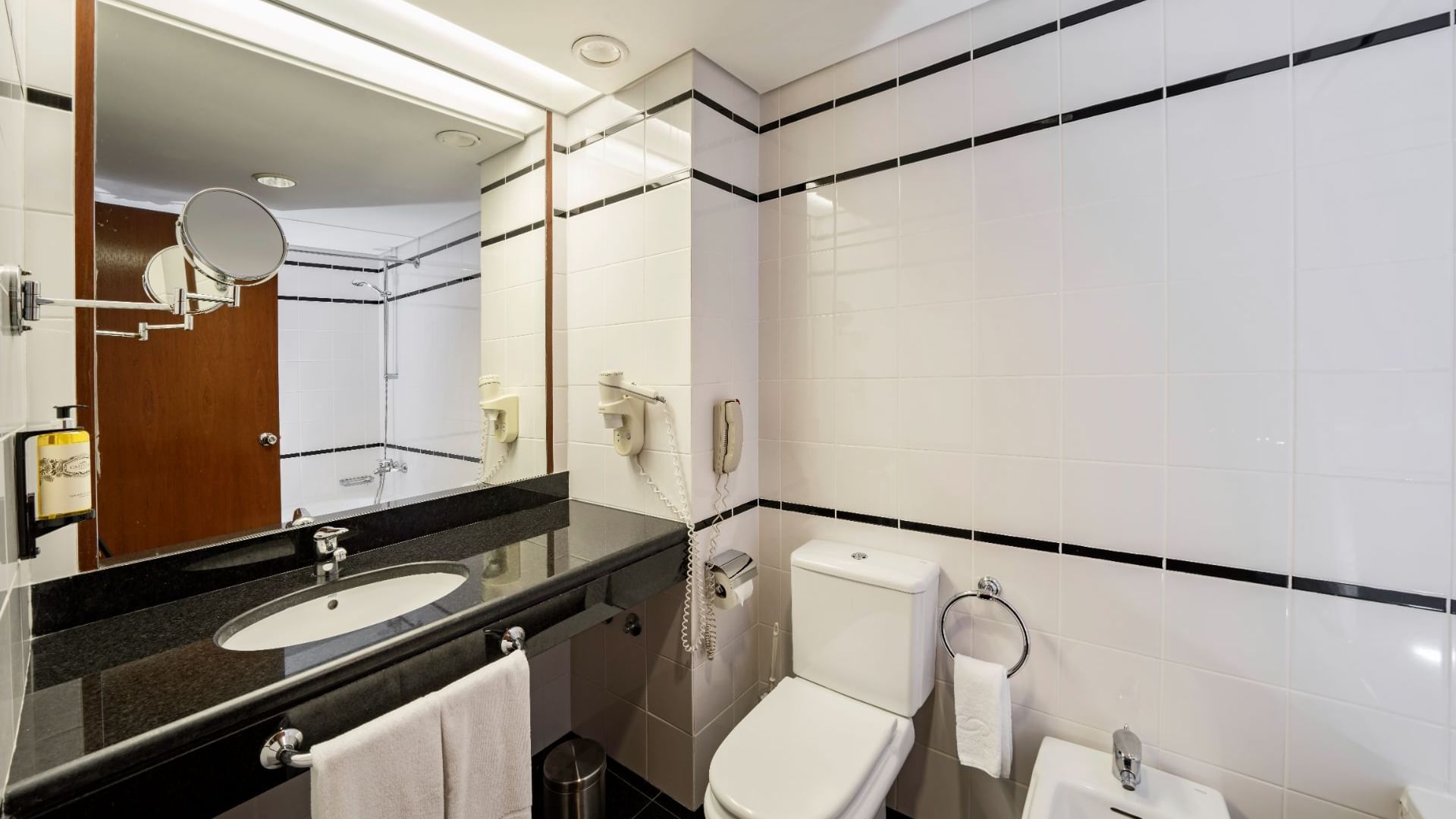 Elegant bathroom interior with large mirror, Bensaude Hotels
