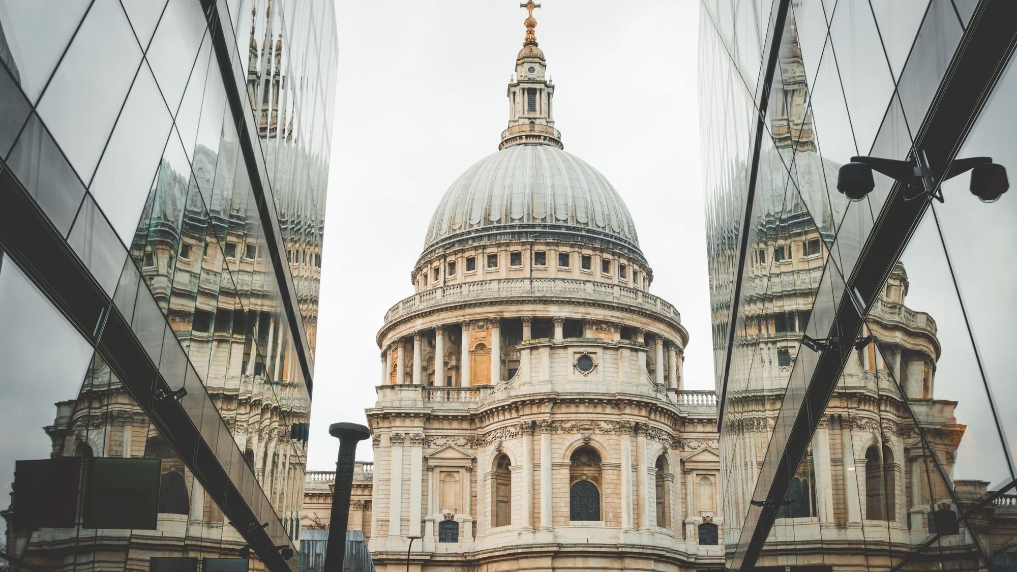 St Paul's seen between two modern glass buildings