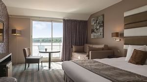 Interior of a double room with a king bed at Originals Hotels