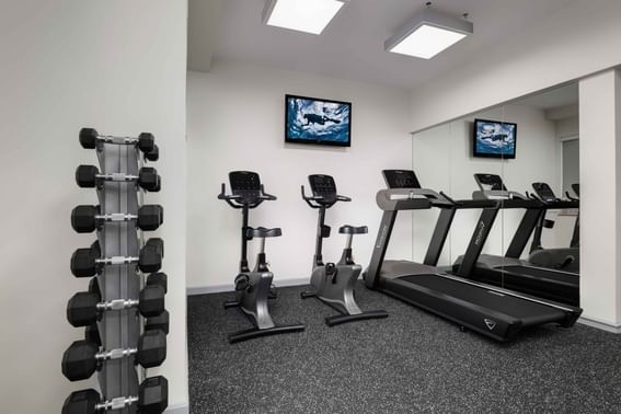 Park Hotel Hong Kong maintains your fitness regimen at Recreation Room equipped with exercise bike, treadmill and dumbbells