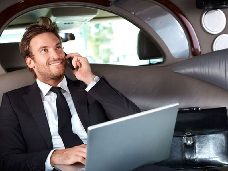 Gentleman making calls in a car while working at Sunway Hotel Phnom Penh