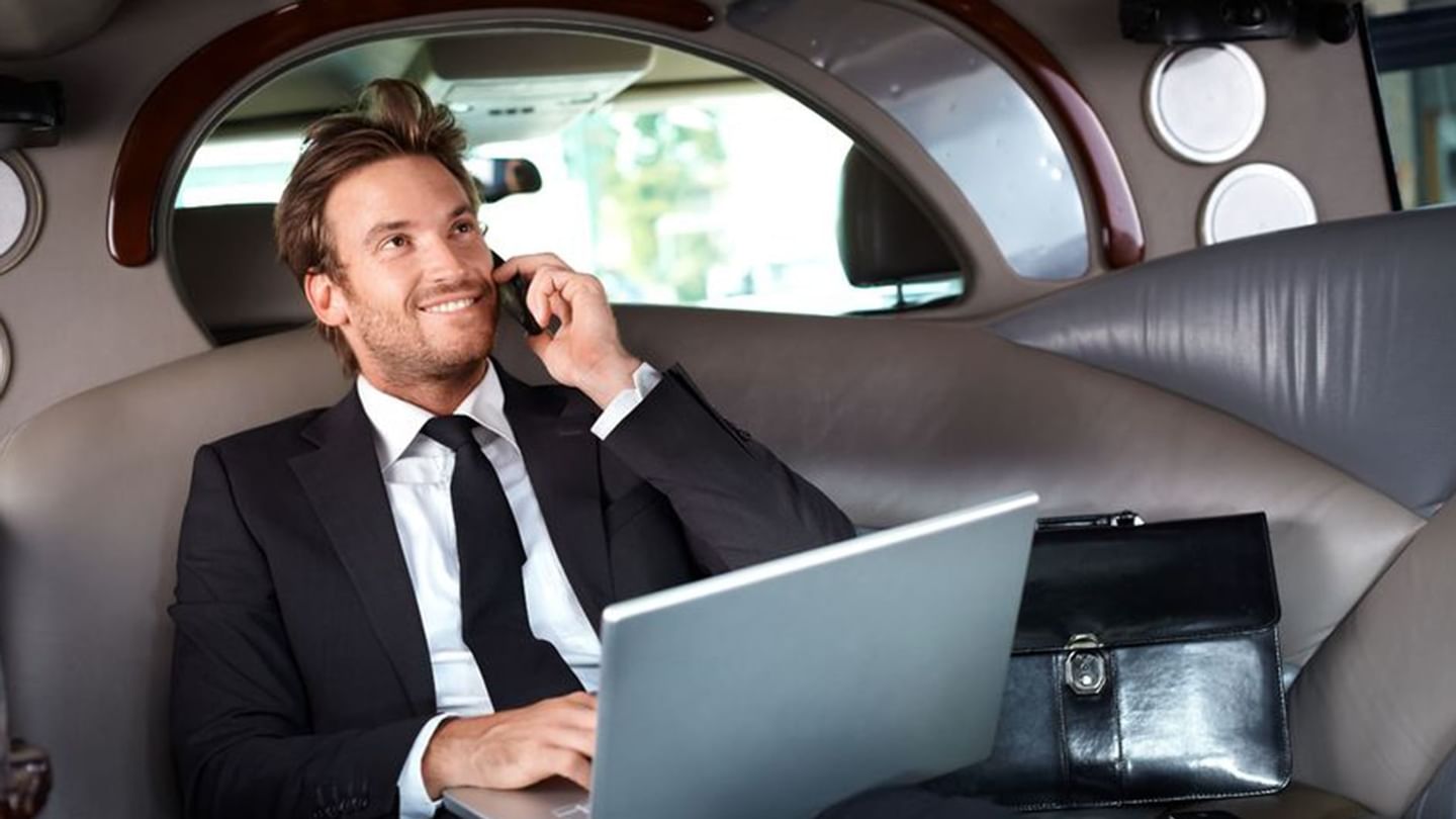 Gentleman making calls in a car while working at Sunway Hotel Phnom Penh