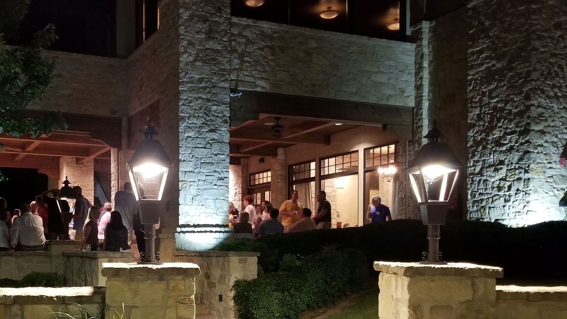 Nighttime view of North patio with lit windows at Shangri-La Monkey Island