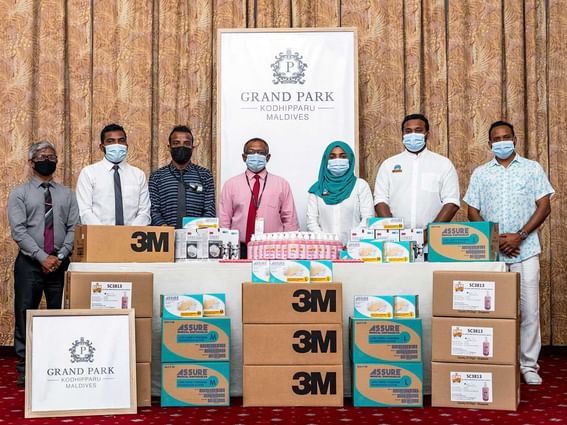 A group of donating healthcare essential at Grand Park Hotel Kodhipparu