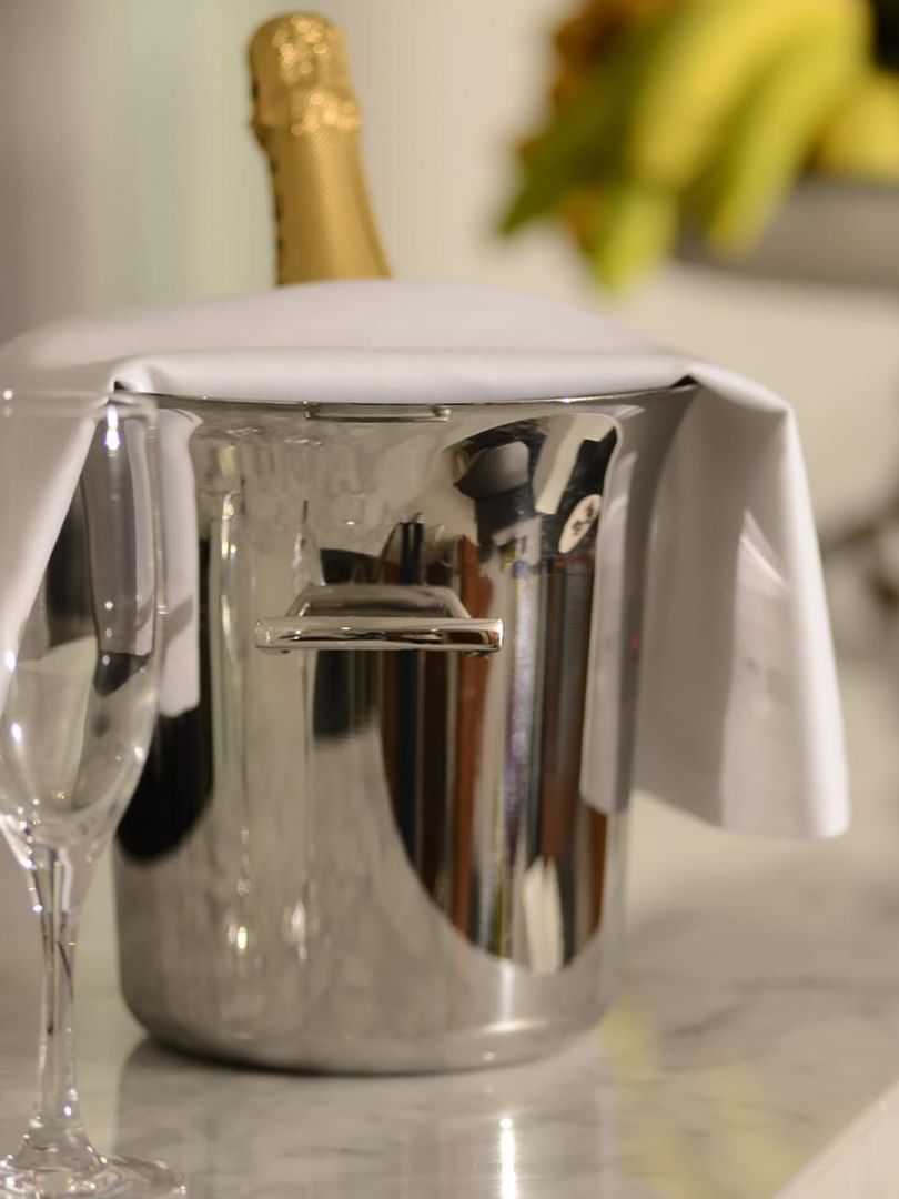 Champagne bucket with flute glasses on a marble counter in Executive Suite at Warwick Stone 55 - Beirut
