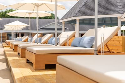 Poolside lounge chairs at Driftaway Hotel and Pool