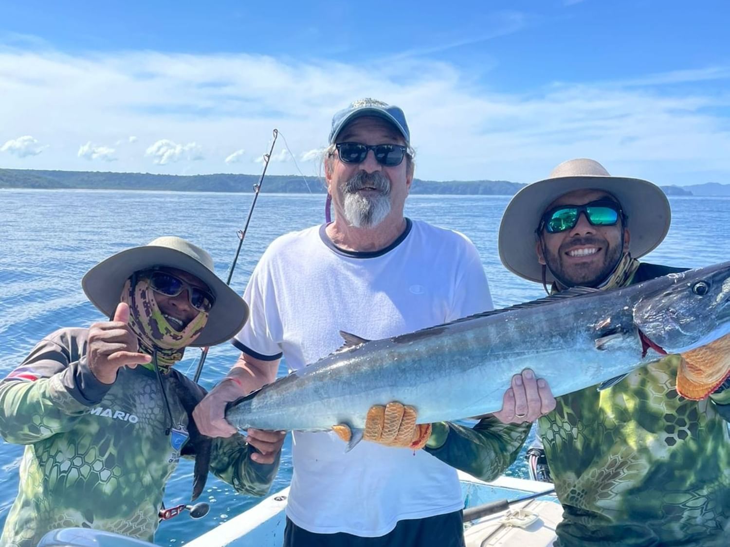 3 fishermen with a fish near Villas Sol Beach Resort