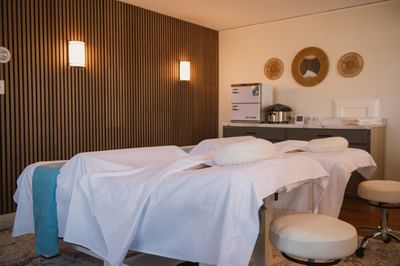 Massage treatment room with two treatment tables at The Spa at Anchorage By The Sea