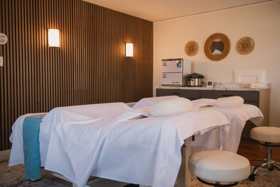 Massage treatment room with two treatment tables at The Spa at Anchorage By The Sea