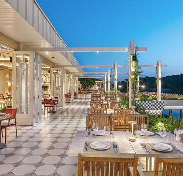 Open-air dining area with tables and chairs of Pascarella Italian Restaurant at Titanic Deluxe Golf Belek