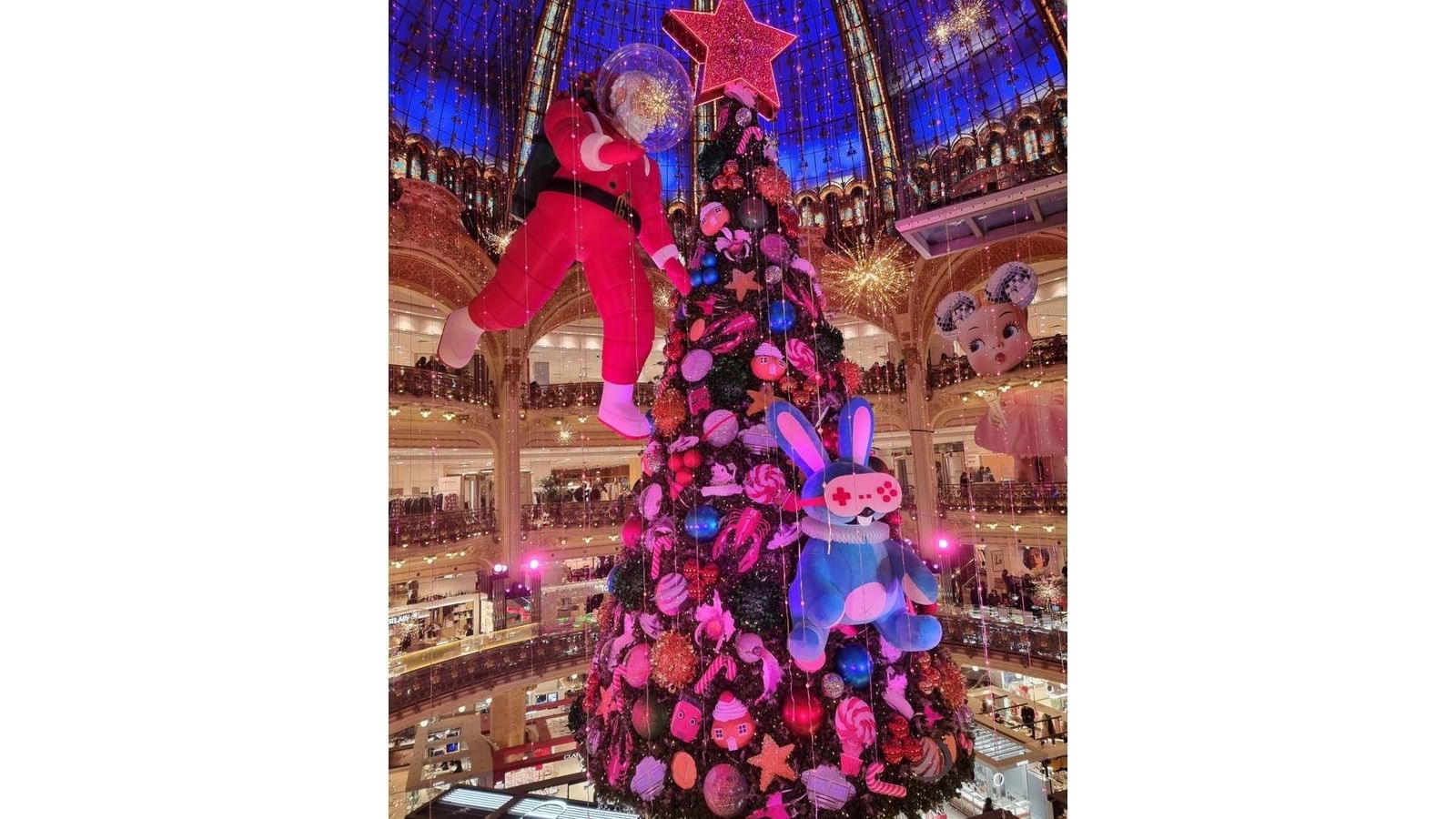 Holiday tree with decorations under a high domed ceiling in the grand lobby of Hotel Westminster Paris