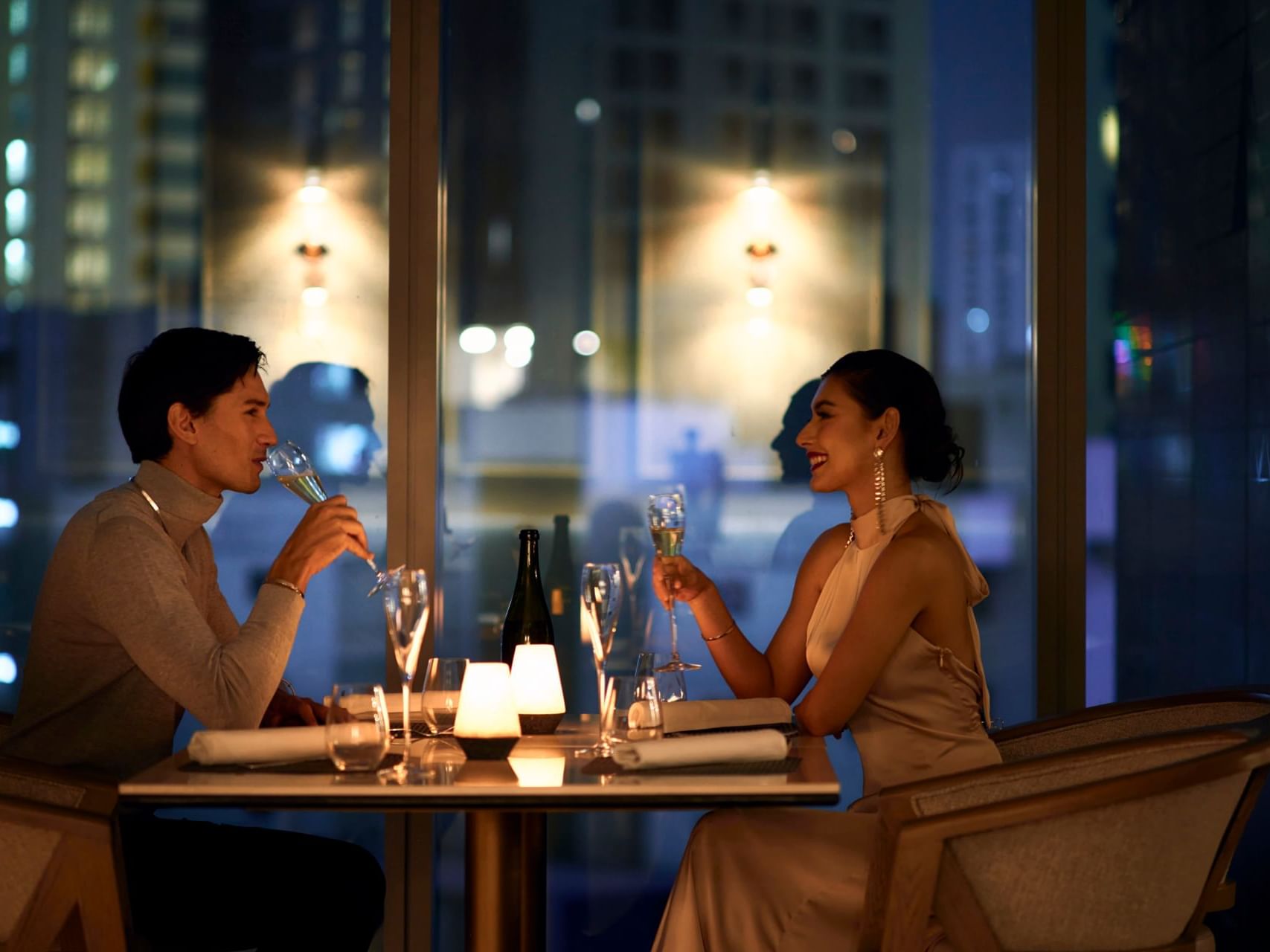 A couple enjoying a meal at Chatrium Hotels & Residences