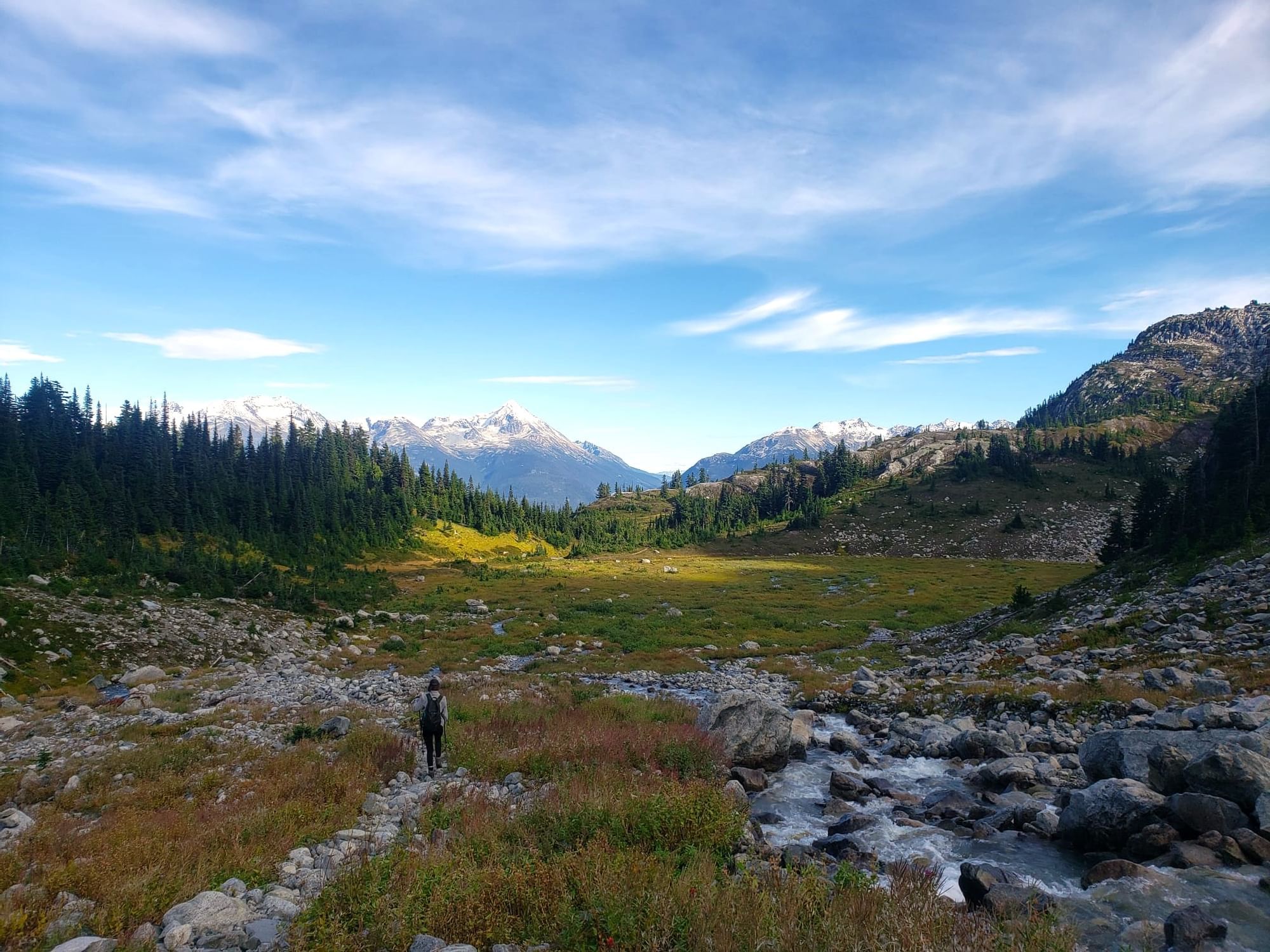 Iceberg Lake with lush greenery and mountain backdrop near Blackcomb Springs Suites