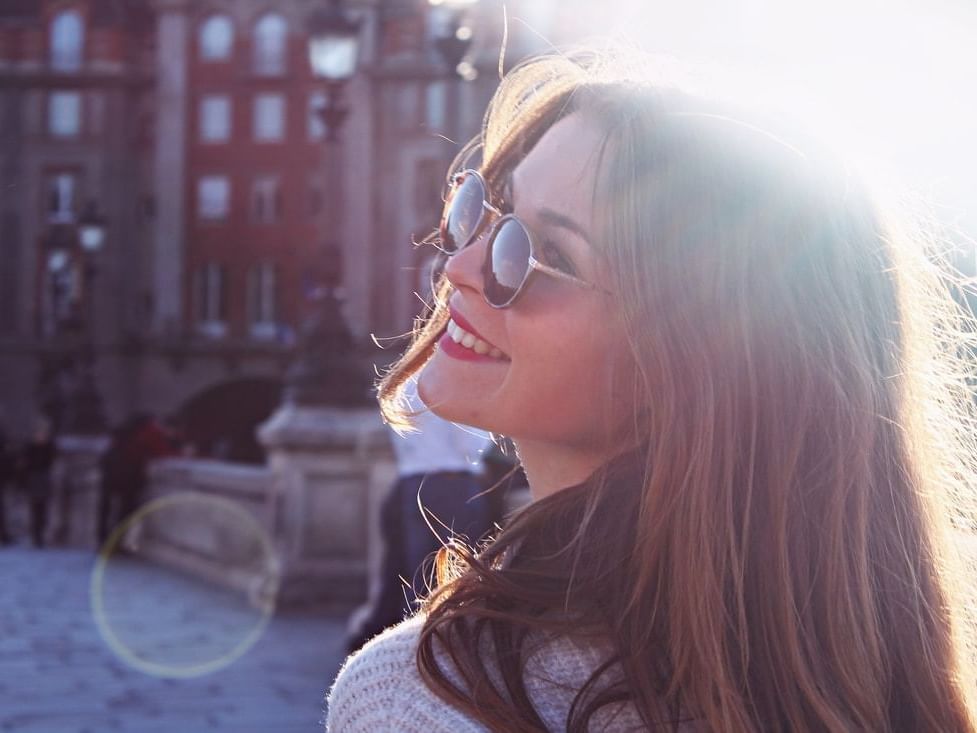 Young beautiful girl with sunglasses near Oliver Like Home