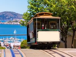 Cable car heading towards Fisherman's Wharf near Hotel Fiona