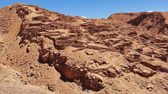 view of sunny Pukara de Quitor near NOI Casa Atacama hotel
