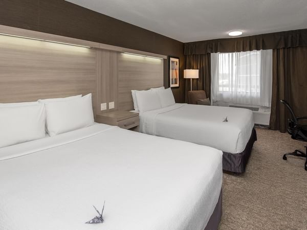 Coast Premium Two Queens room with two queen beds, desk, and modern furnishings at Coast Calgary University Area Hotel by APA