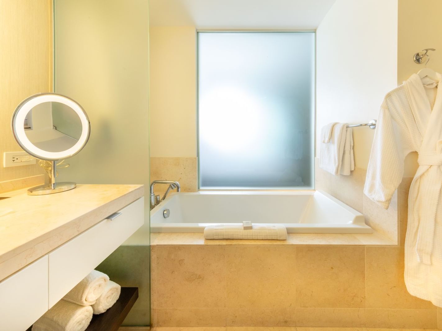 a tub in a hotel bathroom