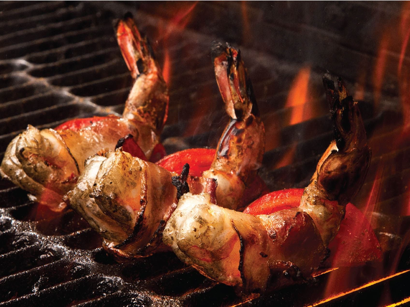 Close-up of lobsters grilling on the BBQ, featuring Seafood on the Pit at Saujana Hotel Kuala Lumpur