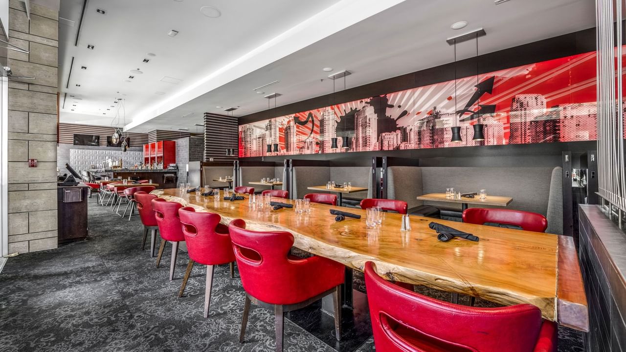 Big dining table and and view of bar area at Prestons