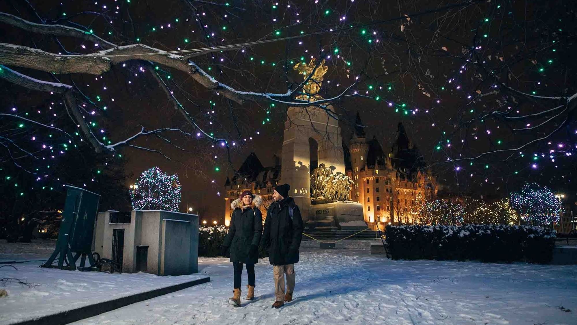 Couple walking on a snowy night at ReStays Ottawa