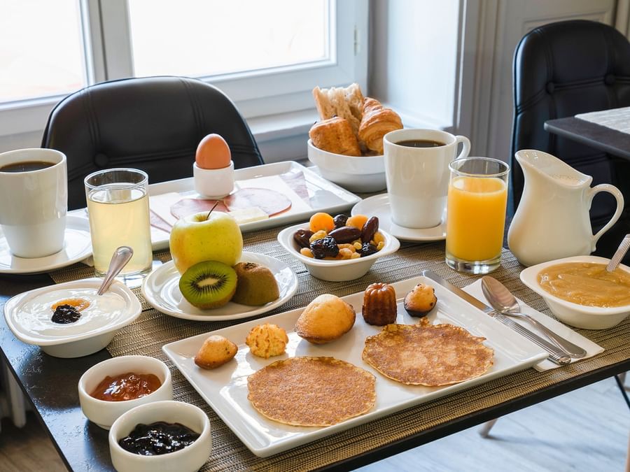 Breakfast plates on a table at Hotel le Saint-Martial