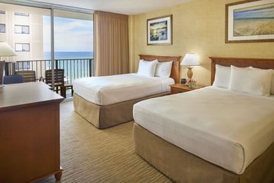 Two double beds with a private balcony in Partial Ocean View at Waikiki Resort Hotel by Sono
