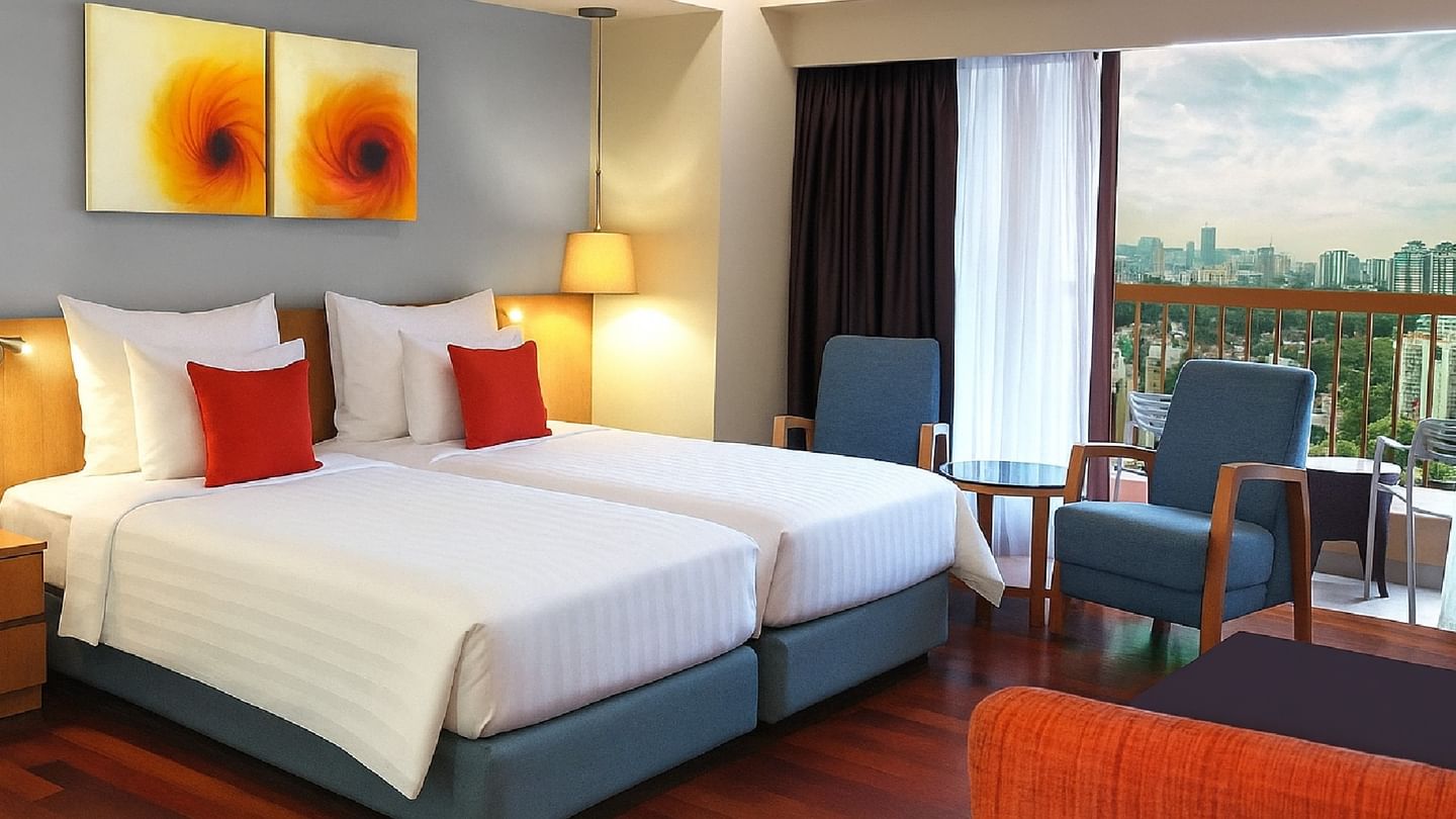 Bright Balcony Studio Twin room at Sunway Hotel Pyramid, featuring two beds and a balcony with city views
