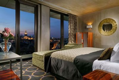 Bedroom with city view in Presidential Suite at Uptown Palace