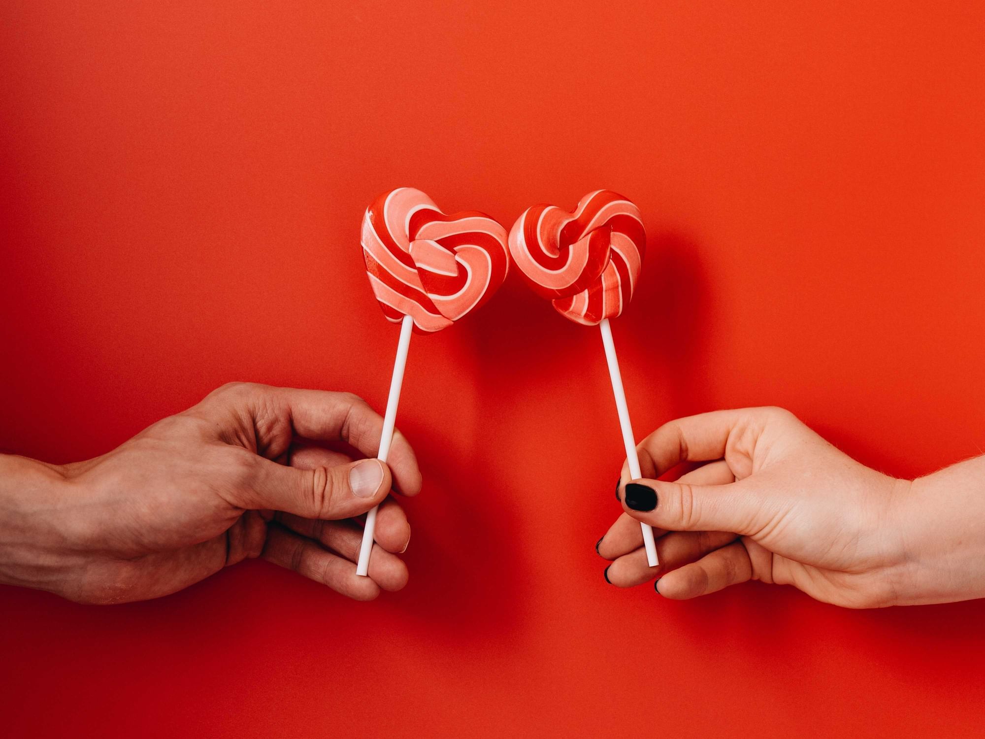 Couple holding candy at Duparc Contemporary Suites