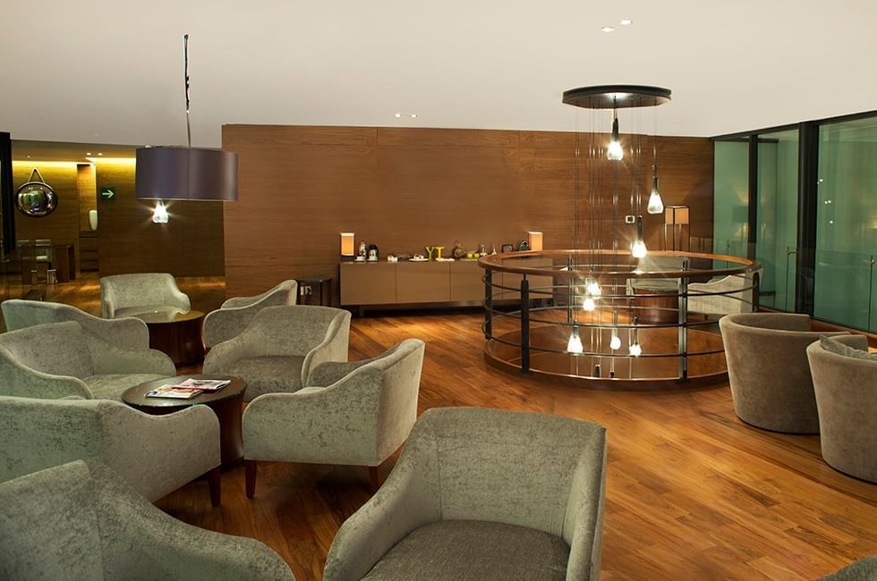 Lounge area with armchairs & wooden walls at Live Aqua Resorts and Residence Club