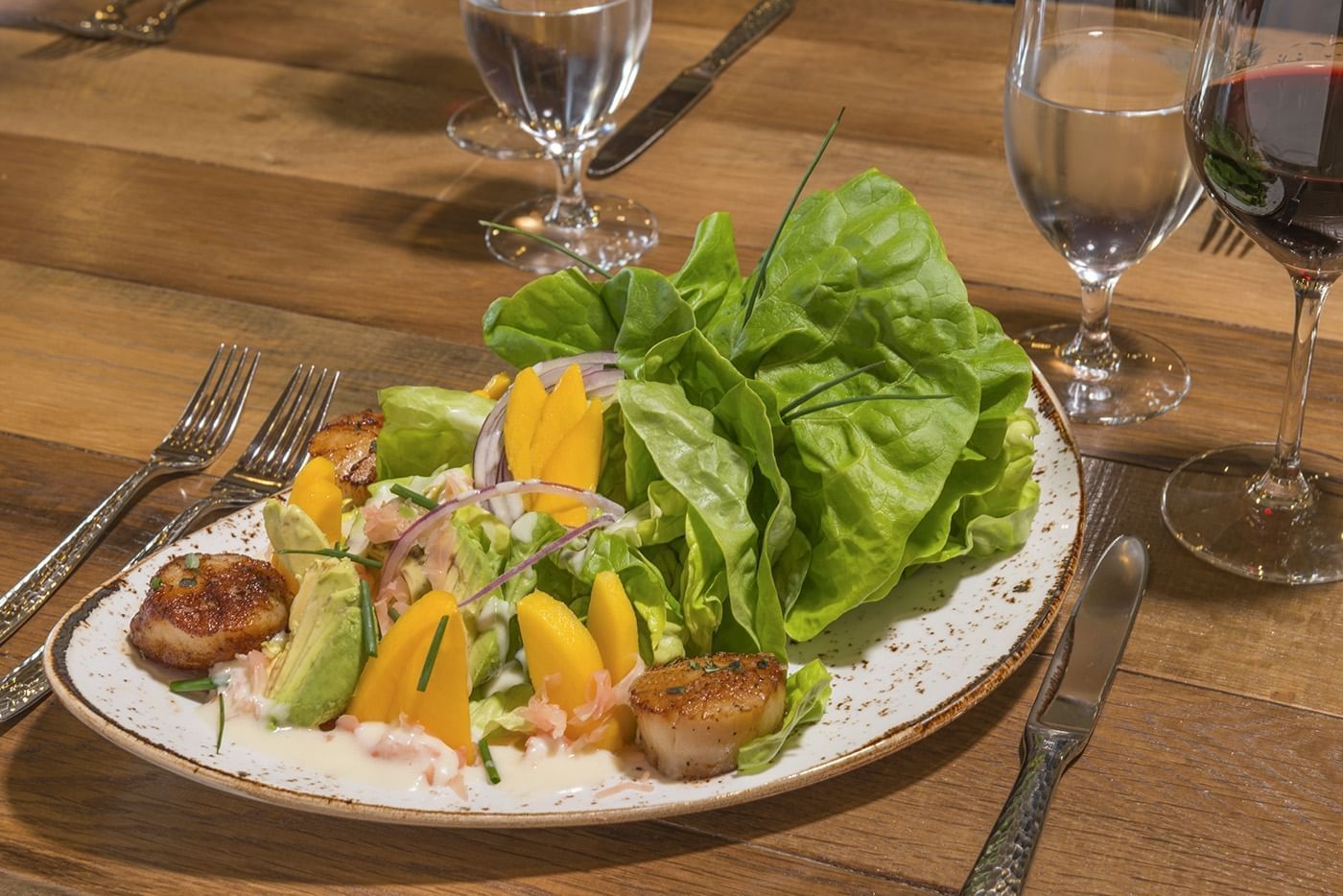 Lorem ipsum An inviting scallops dish with a side of greens