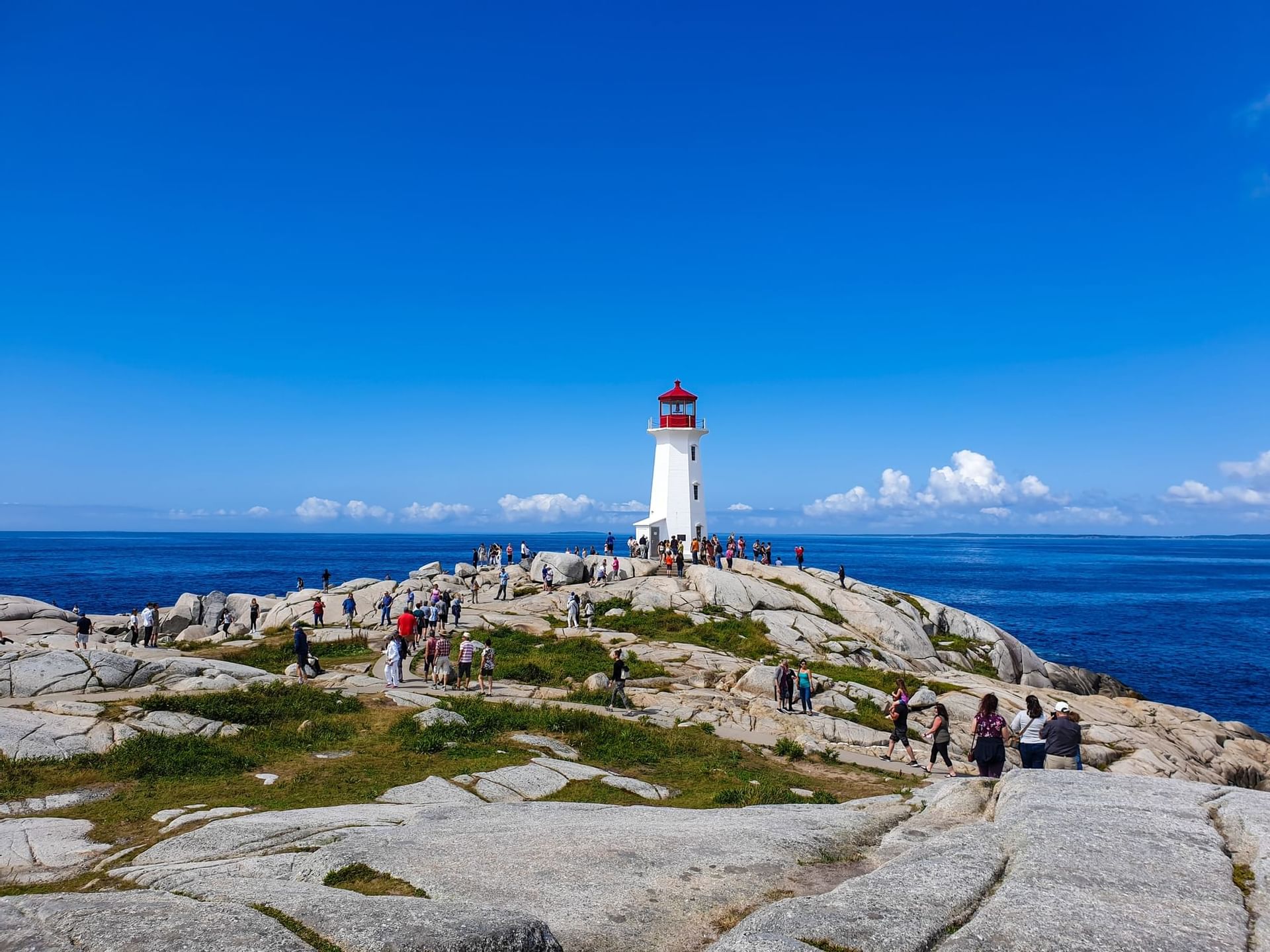 Crowd of people by a lighthouse near Atlantica Hotel Halifax