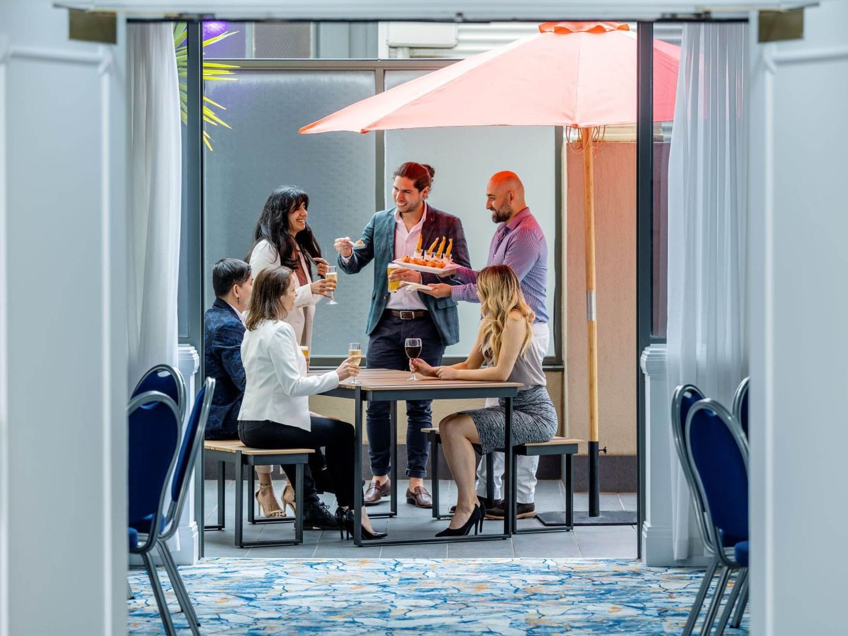 People dining & lounging in Torrens Balcony cocktail catering at Grand Chancellor Adelaide