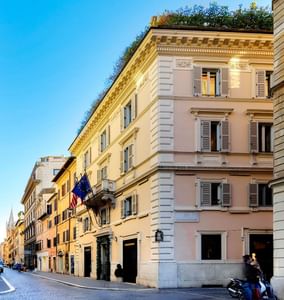 Exterior view of the hotel featuring black windows & balconies at Margutta 19