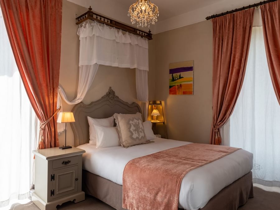 Double Classic bedroom with a king bed at The Originals Hotels