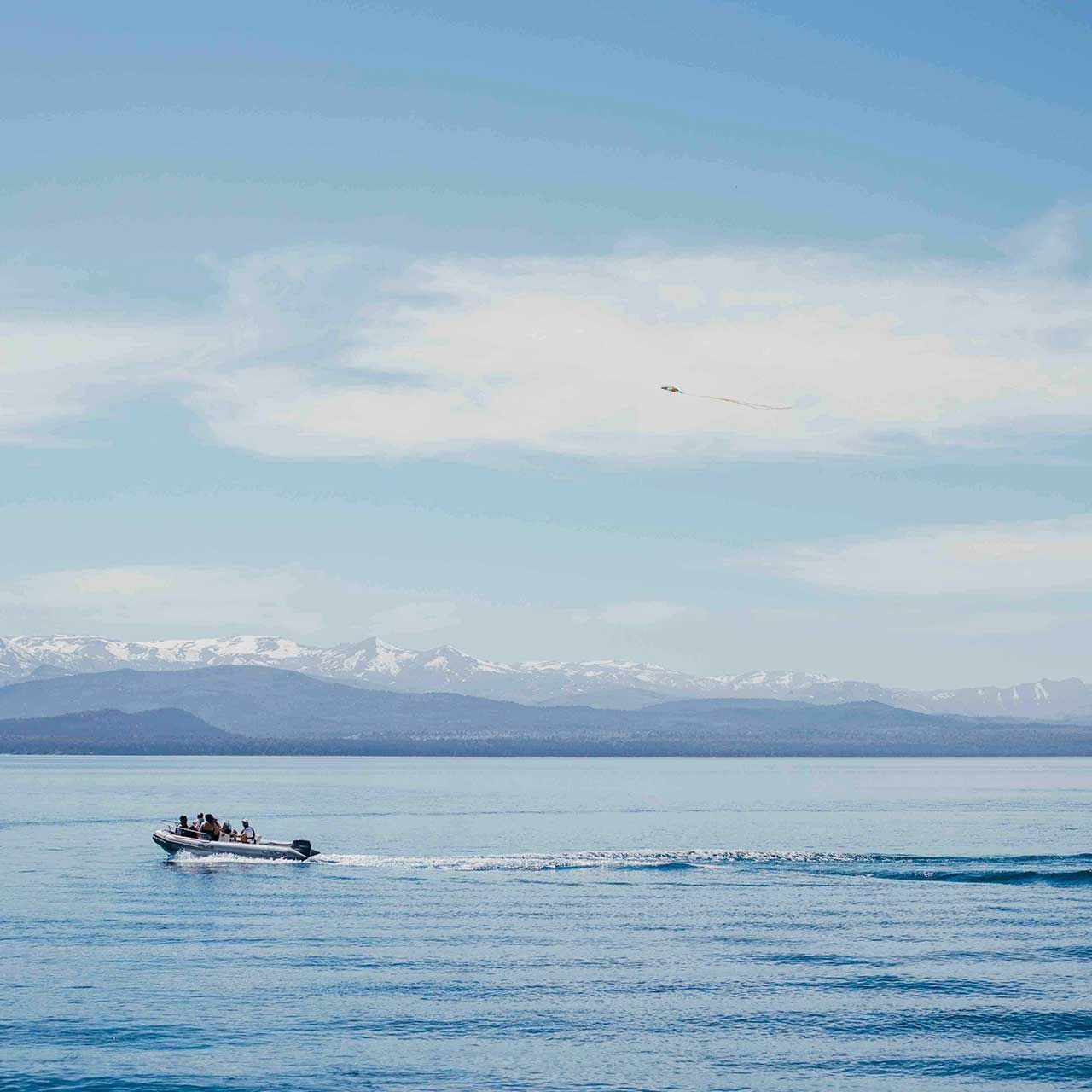 Boat ride on a lake near La Cascada Casa Patagonica by DON