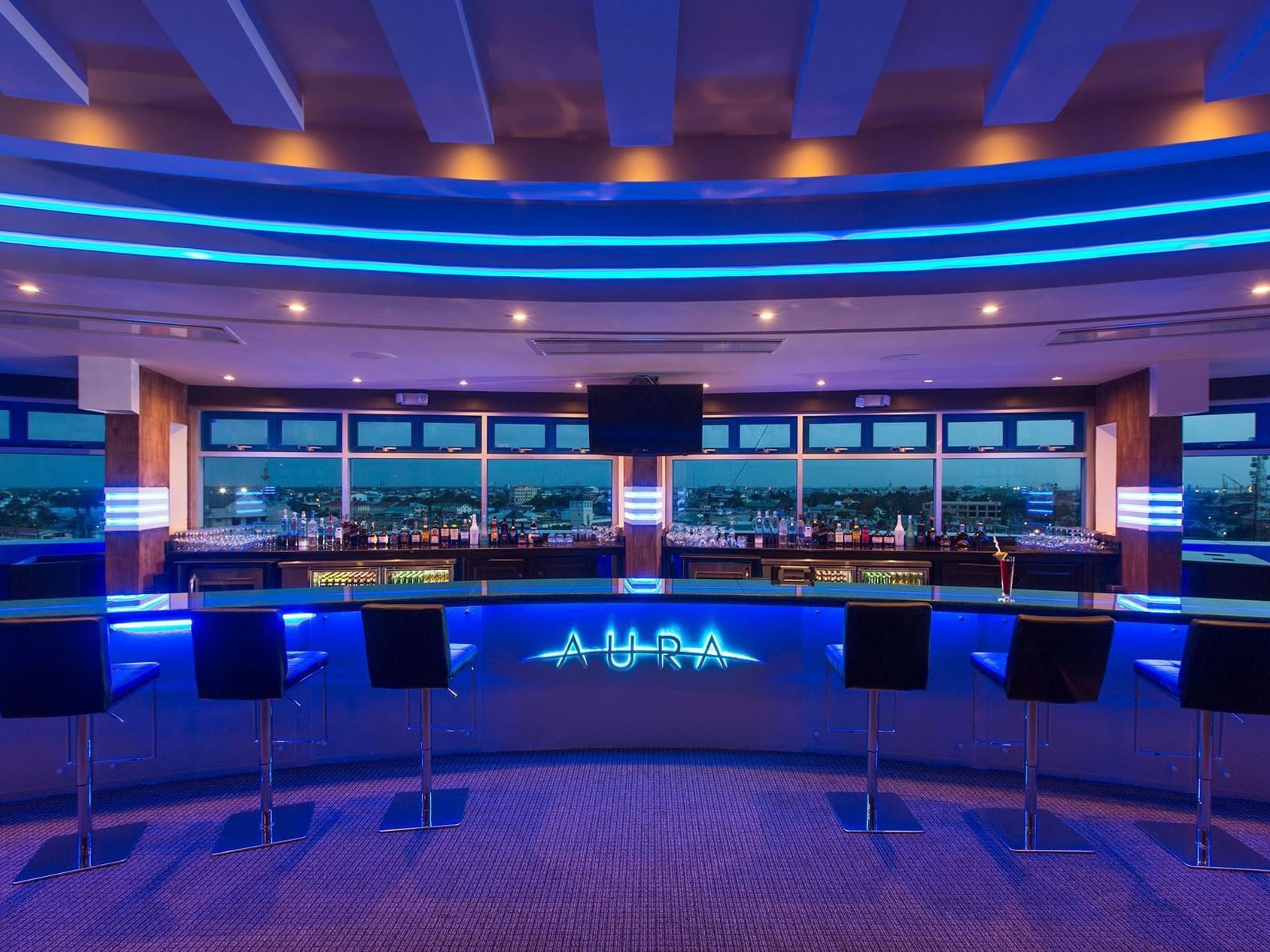 Bar area with stools and drinks at Pegasus Hotel Guyana