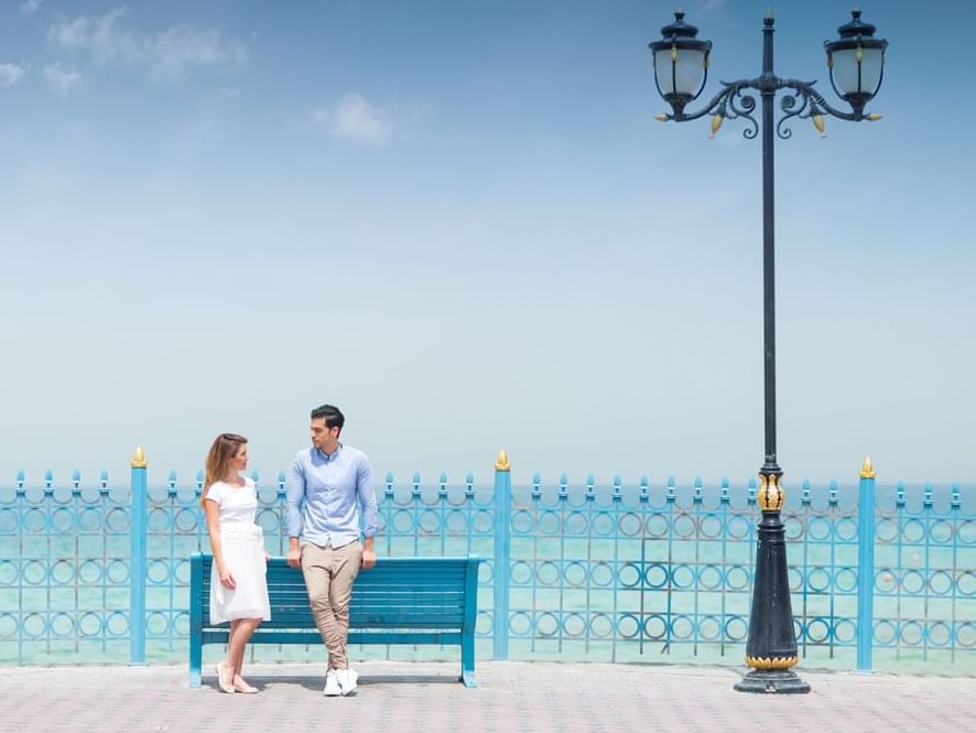 A couple in Ajman Corniche near Ajman Hotel