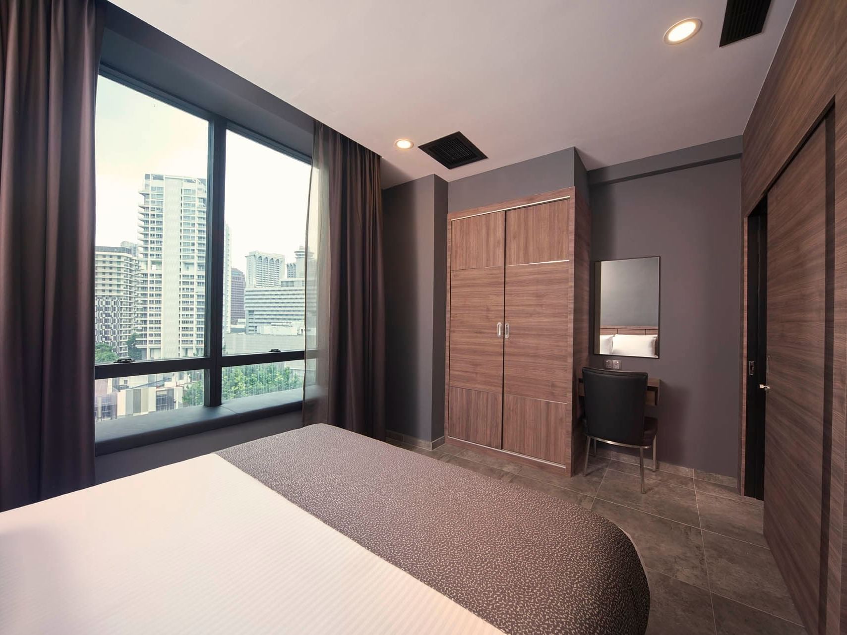 Image 40: Cozy One Bedroom with city views, wood furnishings, and a comfy bed bathed in natural light at Orchard Grand Court