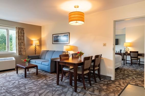 A shot of the couch and table in the room sutie