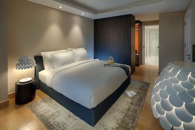 spacious hotel room with king bed