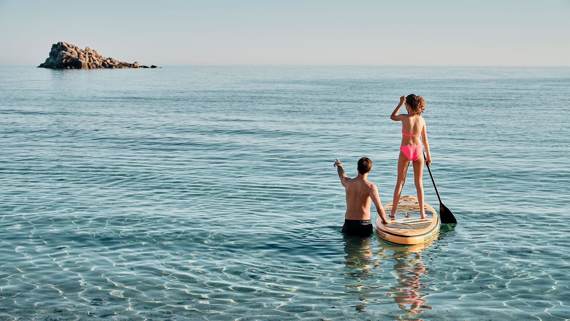 Couples Riding a Boat Near Falkensteiner Resort Capo Boi