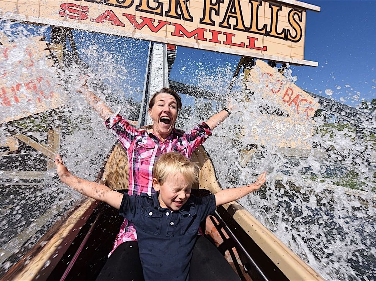 Mother and son enjoying a water ride near Best Western Premier