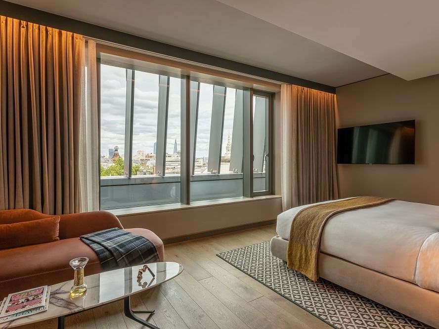 Interior of Junior Suite with city view at The Londoner Hotel