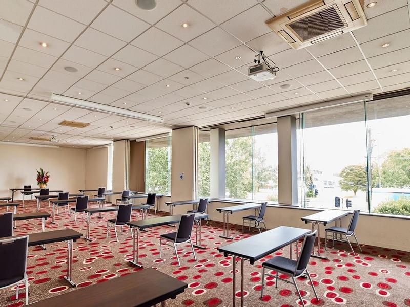 Classroom set-up in Lake Room with carpeted floors at Pullman Albert Park