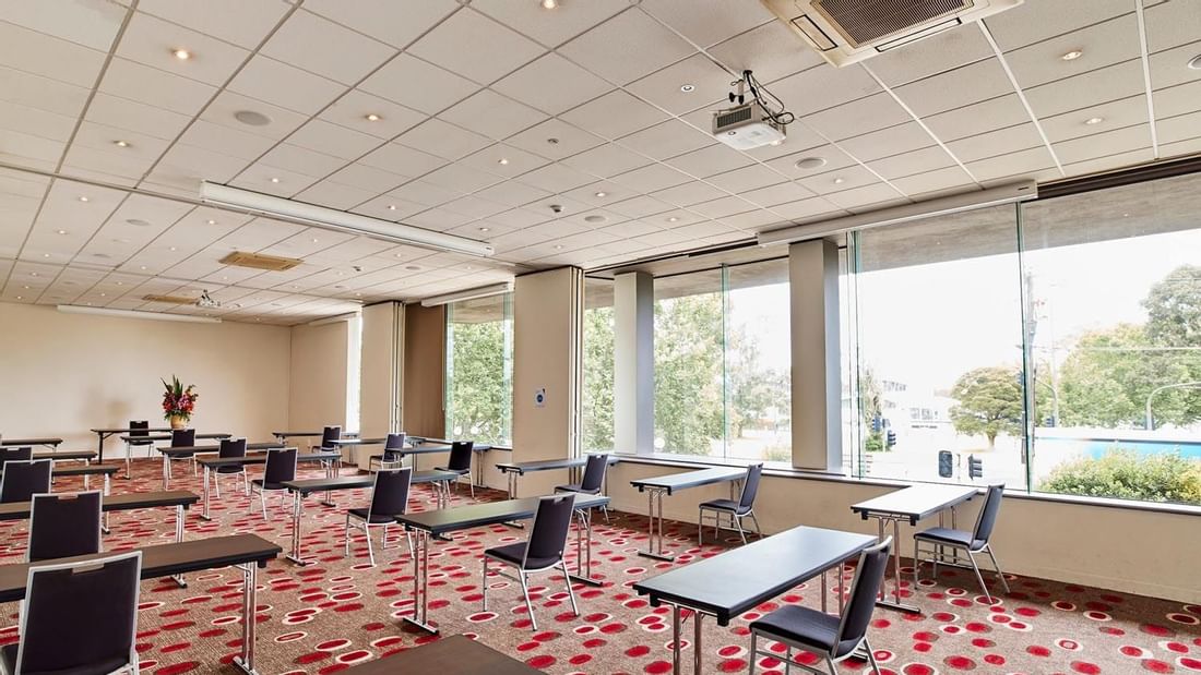 Classroom set-up in Lake Room with carpeted floors at Pullman Albert Park